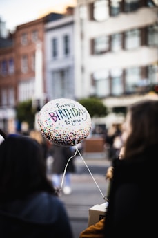 selective focus photography of happy birthday balloon
