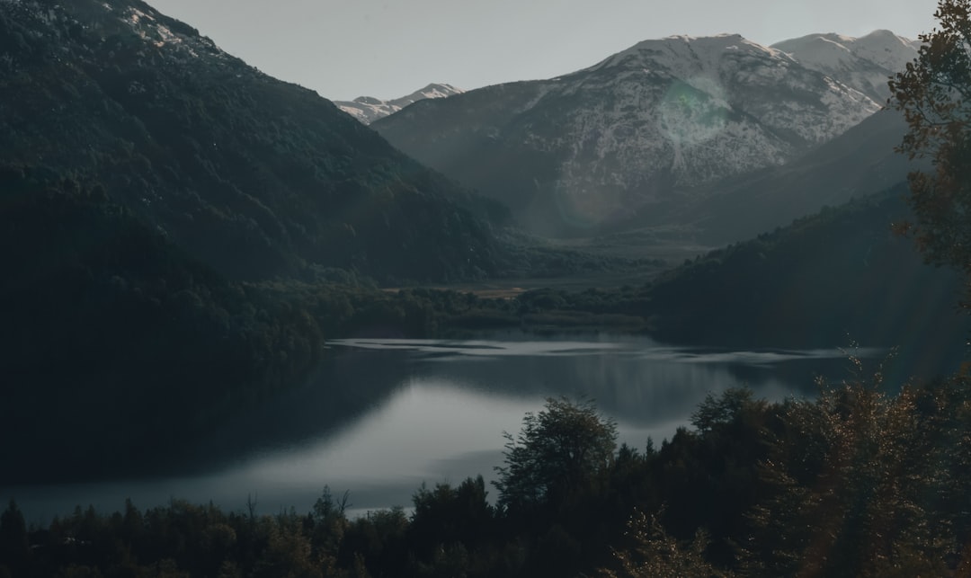 green mountains near lake during daytime