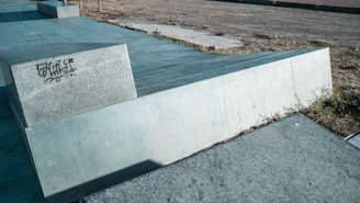 Sidewalk-adjacent exterior surface showing a smooth finish post graffiti removal.
