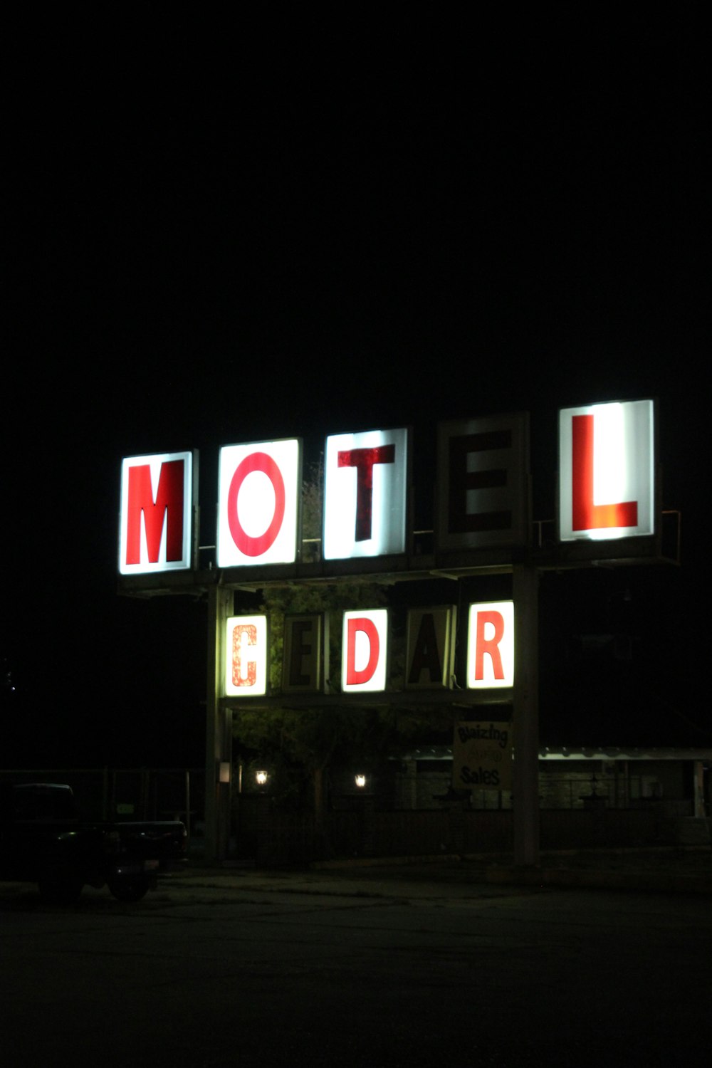 red and white open neon sign