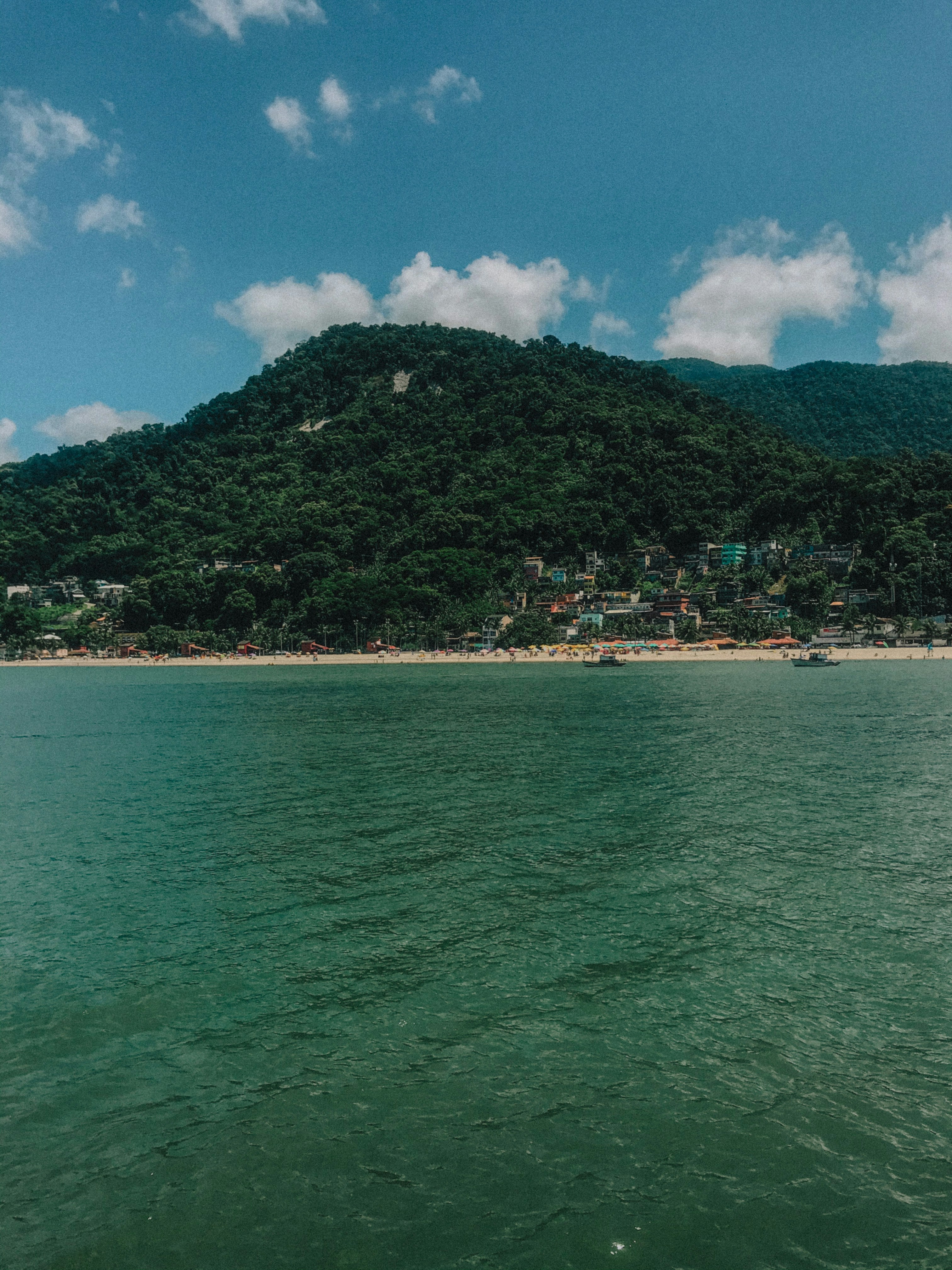Lush green tropical island landscape with mountains and ocean view