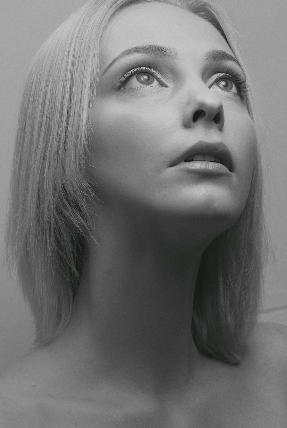 grayscale photo of womans face