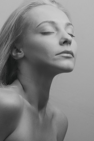 grayscale photo of womans face