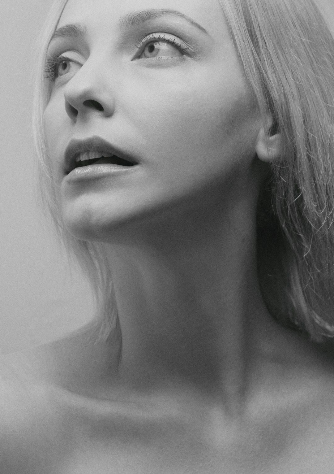 woman with blonde hair in grayscale photography