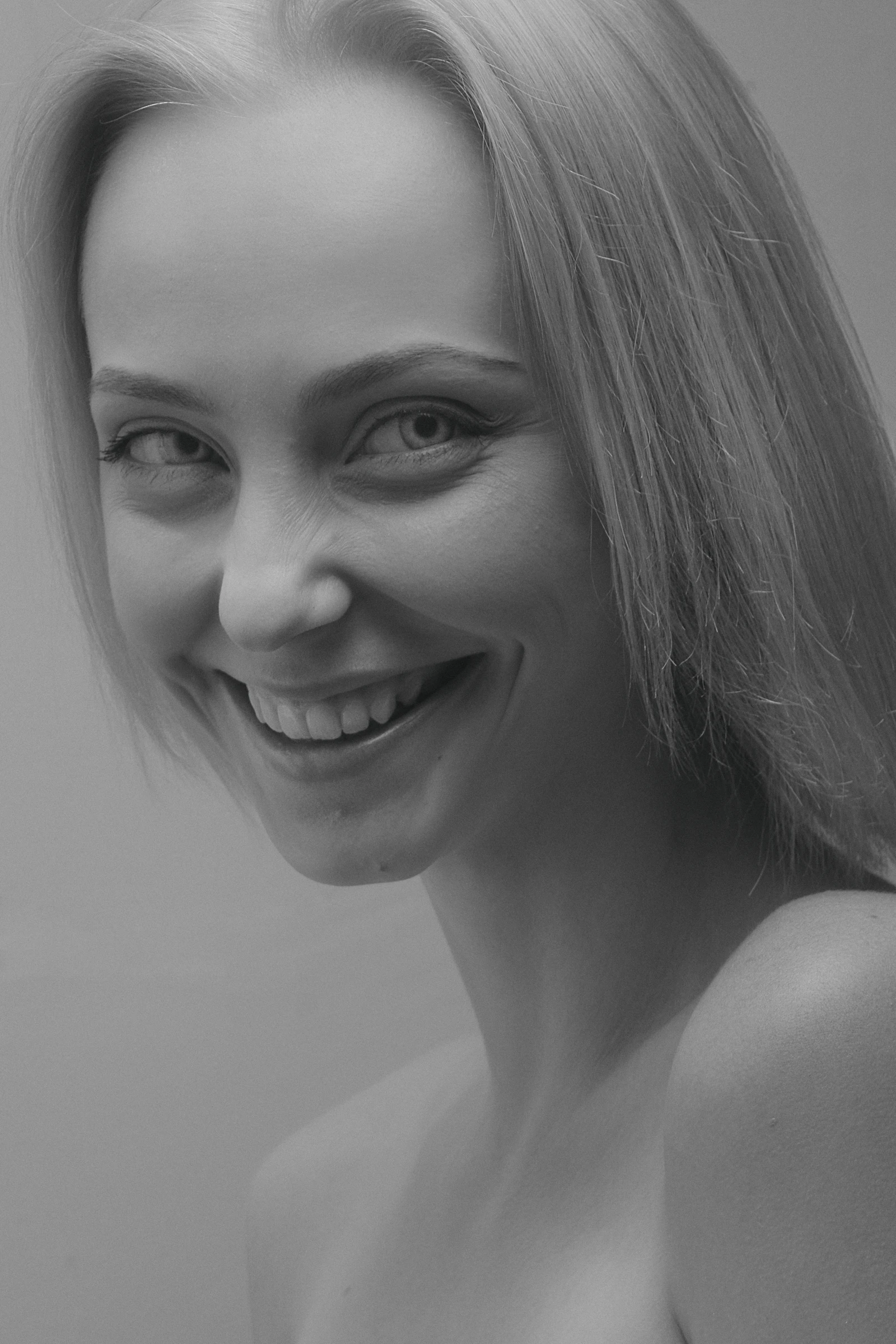 Portrait of a patient with a bright, whitened smile after an in-studio treatment