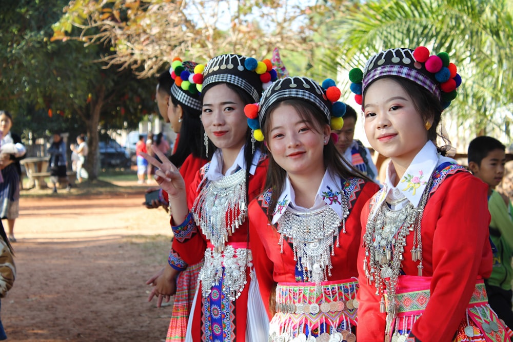 woman in red and white floral dress with blue and white headdress