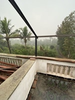 Balcony view from the family suite overlooking the lush Barkot landscape.