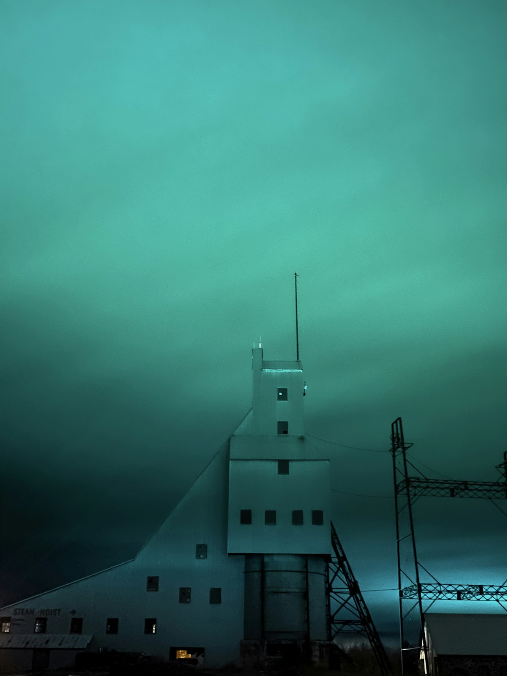 white concrete building under gray sky