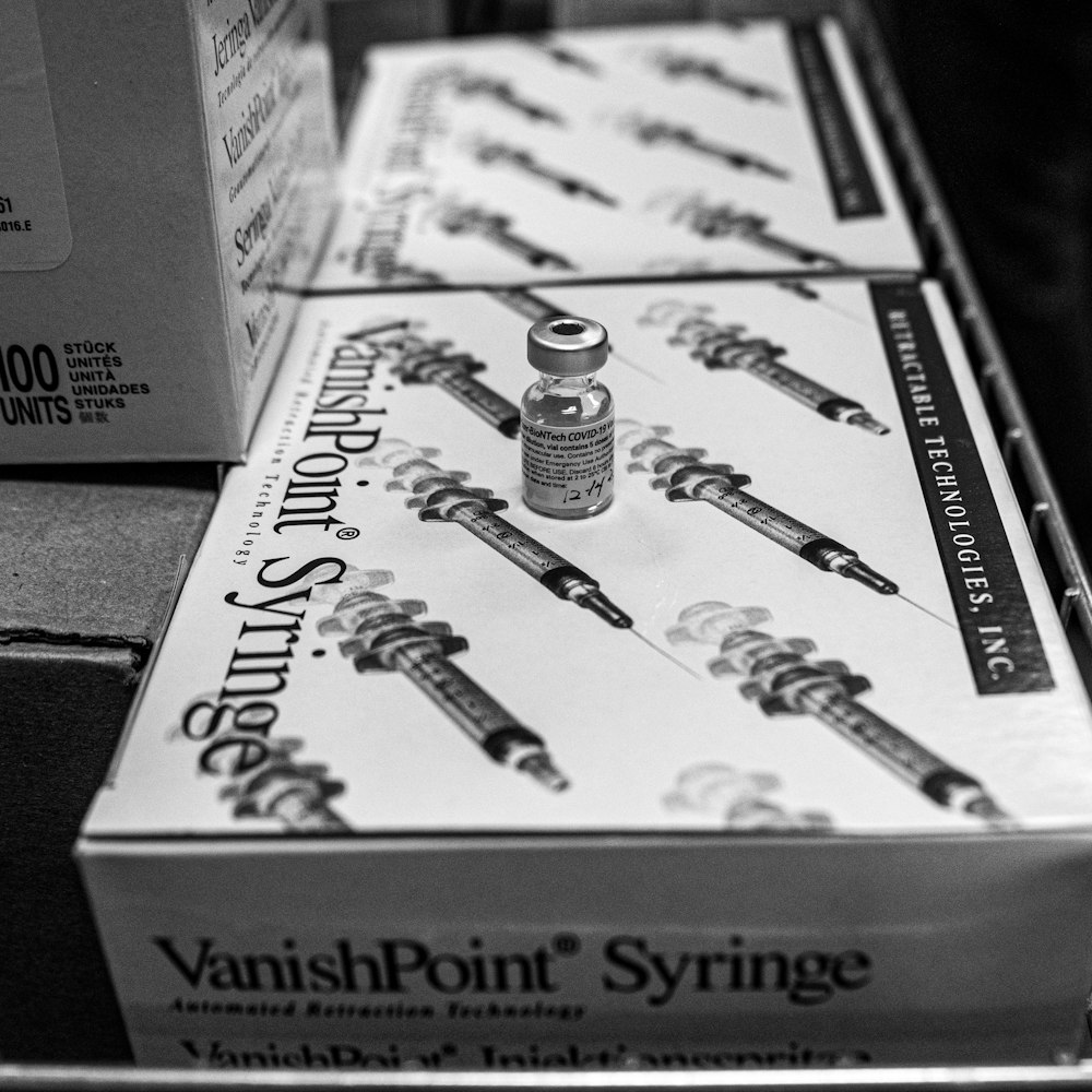 a box of varnish point syringes sitting on a table