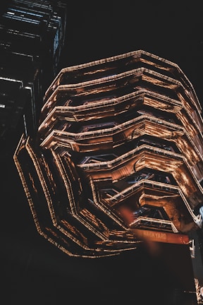 The Hexatic International headquarters building illuminated at dusk.