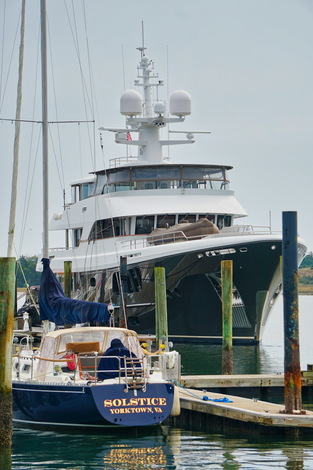 white and blue yacht on dock during daytime