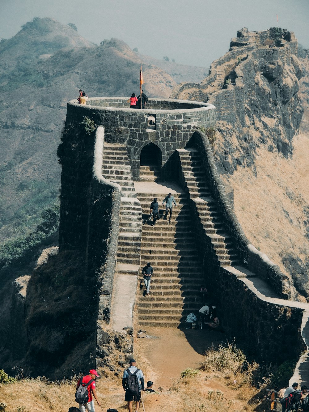 people walking on concrete bridge during daytime