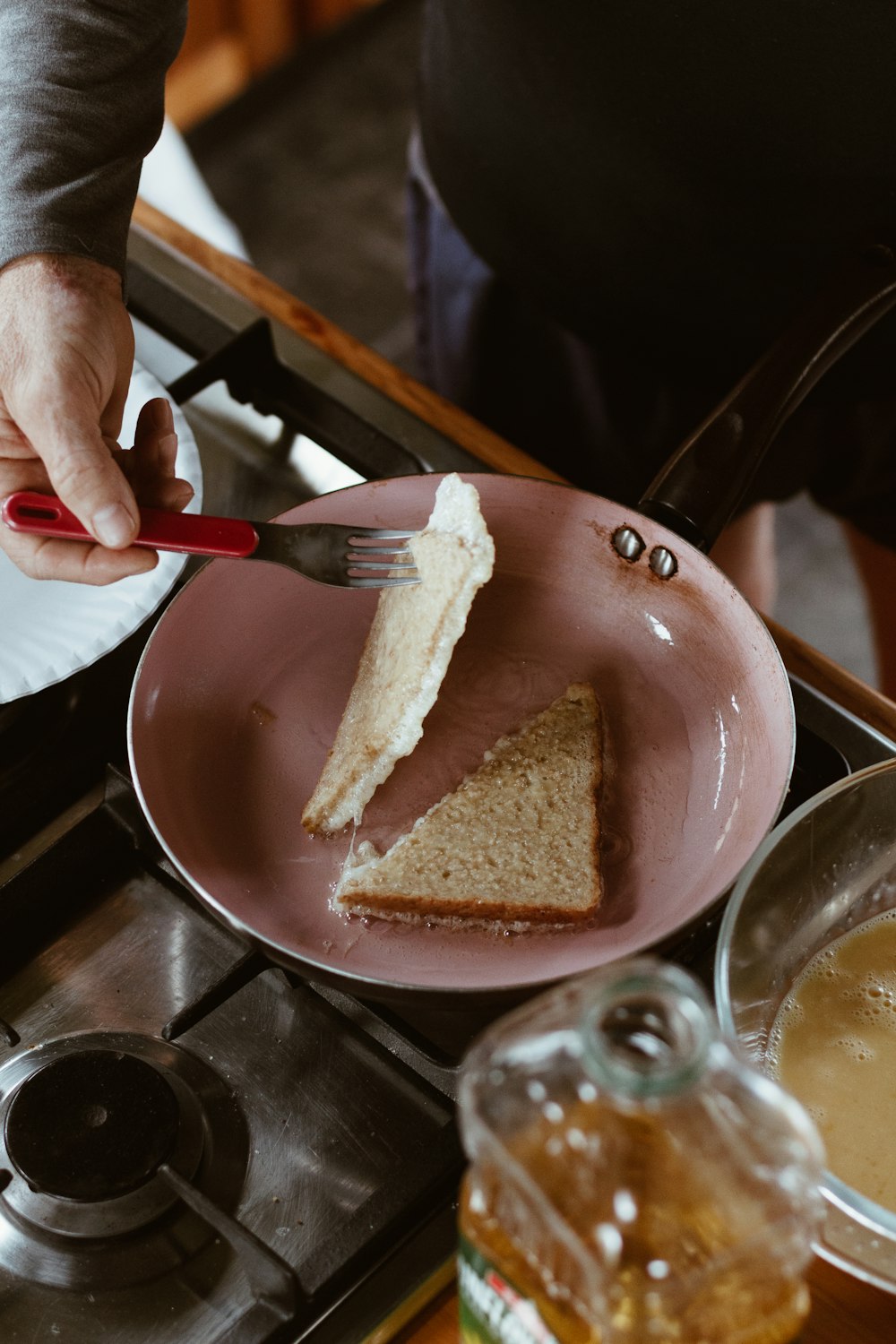 person holding brown bread on blue ceramic plate