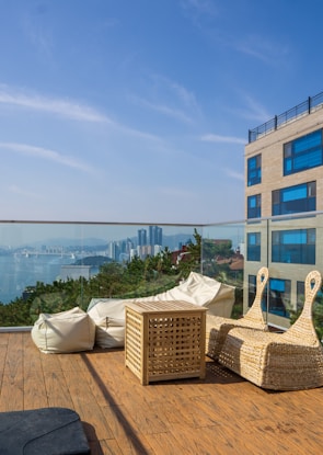 Close-up of a stylish apartment balcony overlooking the Ha Long Bay.