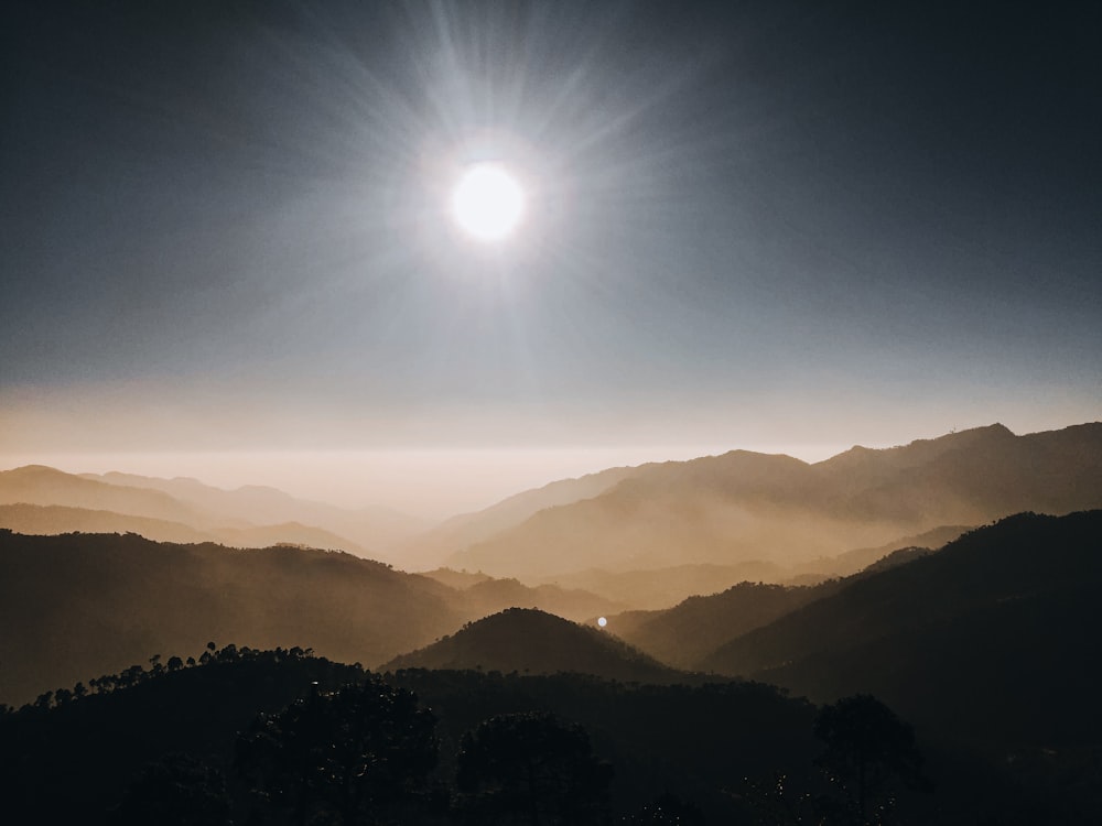 silhouette of mountains during sunrise