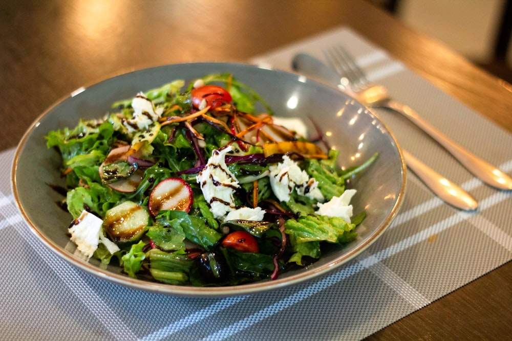 vegetable salad on clear glass bowl