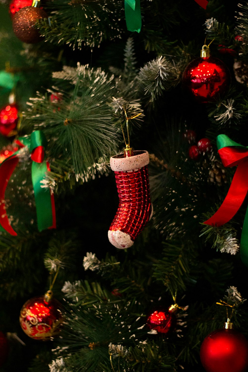 green and red christmas tree with baubles