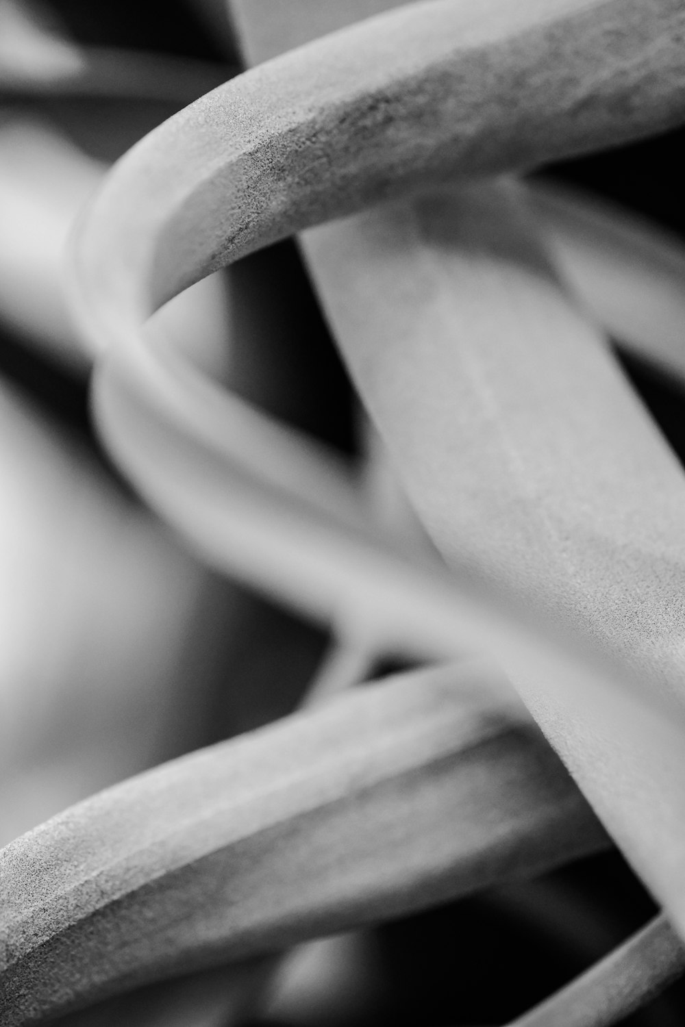 grayscale photo of a white spiral wire