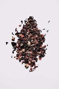 brown and black fruit on white surface