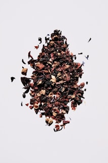 brown and black fruit on white surface