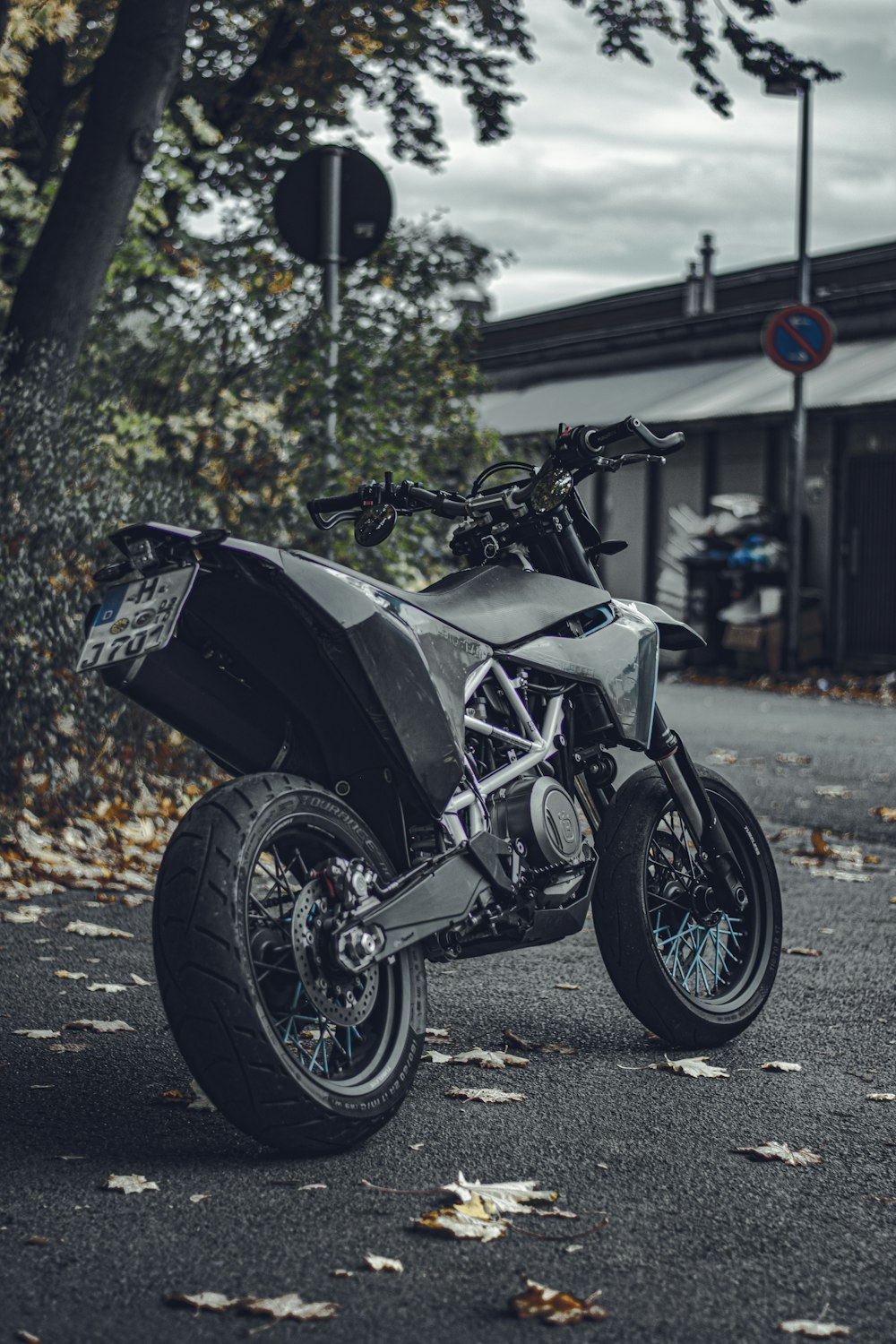 black and silver sports bike parked on the street during daytime