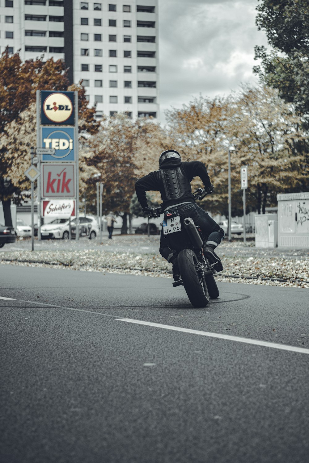 man in black jacket riding motorcycle on road during daytime