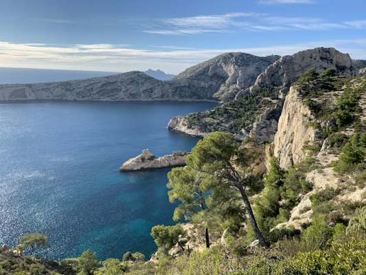 Green trees on brown rocky mountain beside blue sea under blue sky during daytime — Marseille, France