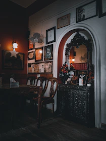 Cozy interior of Tripura Sattva with warm lighting and traditional decor inviting guests.