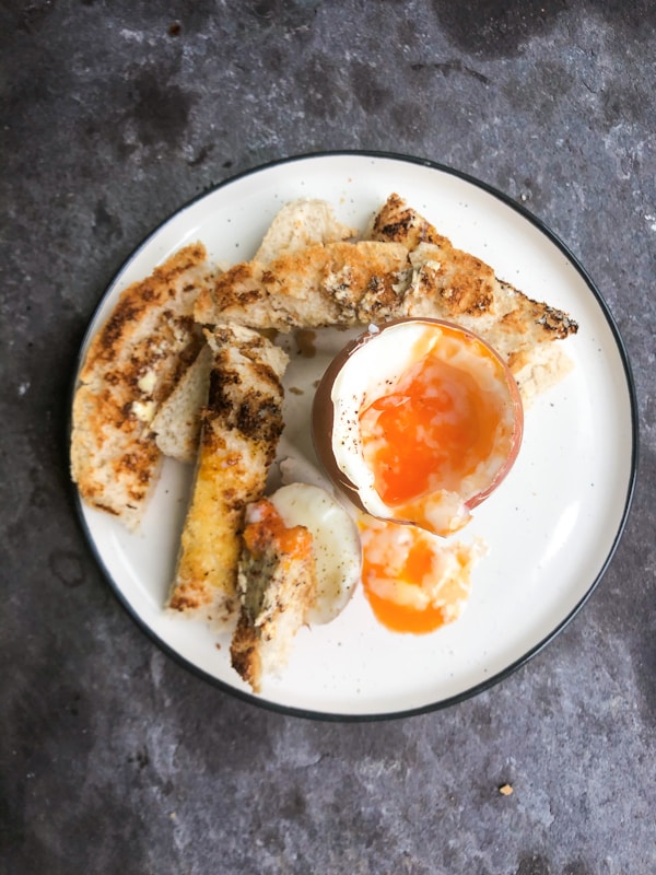 Fried egg on white ceramic plate