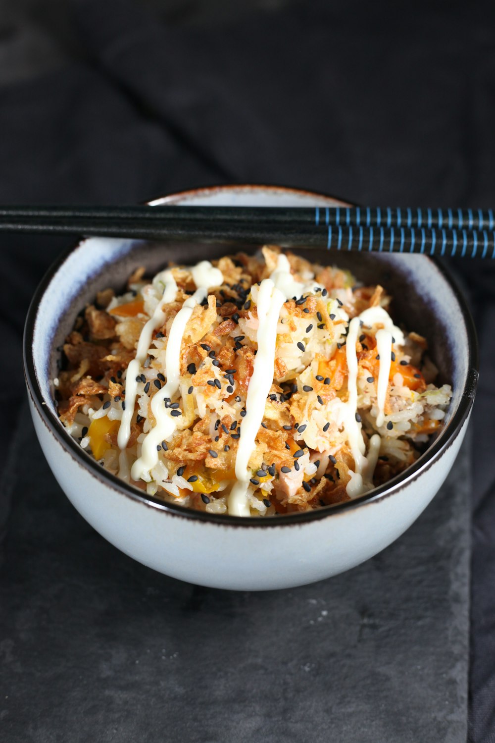 white ceramic bowl with rice and meat dish