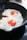 Two fried eggs with vividly orange yolks are sizzling in a cast iron skillet. The edges of the whites are bubbly and slightly crispy, indicating they are being cooked over heat.