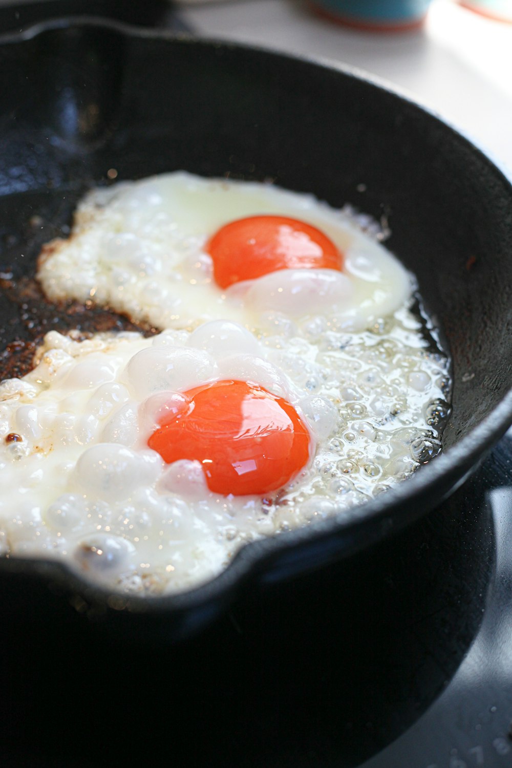 sunny side up egg on black cooking pan