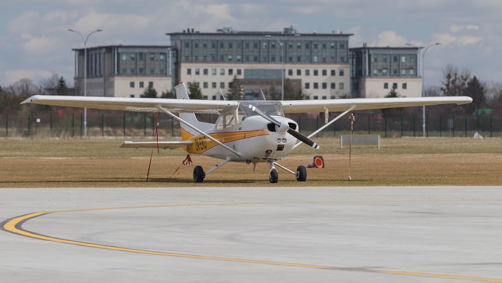 white and red airplane on airport during daytime