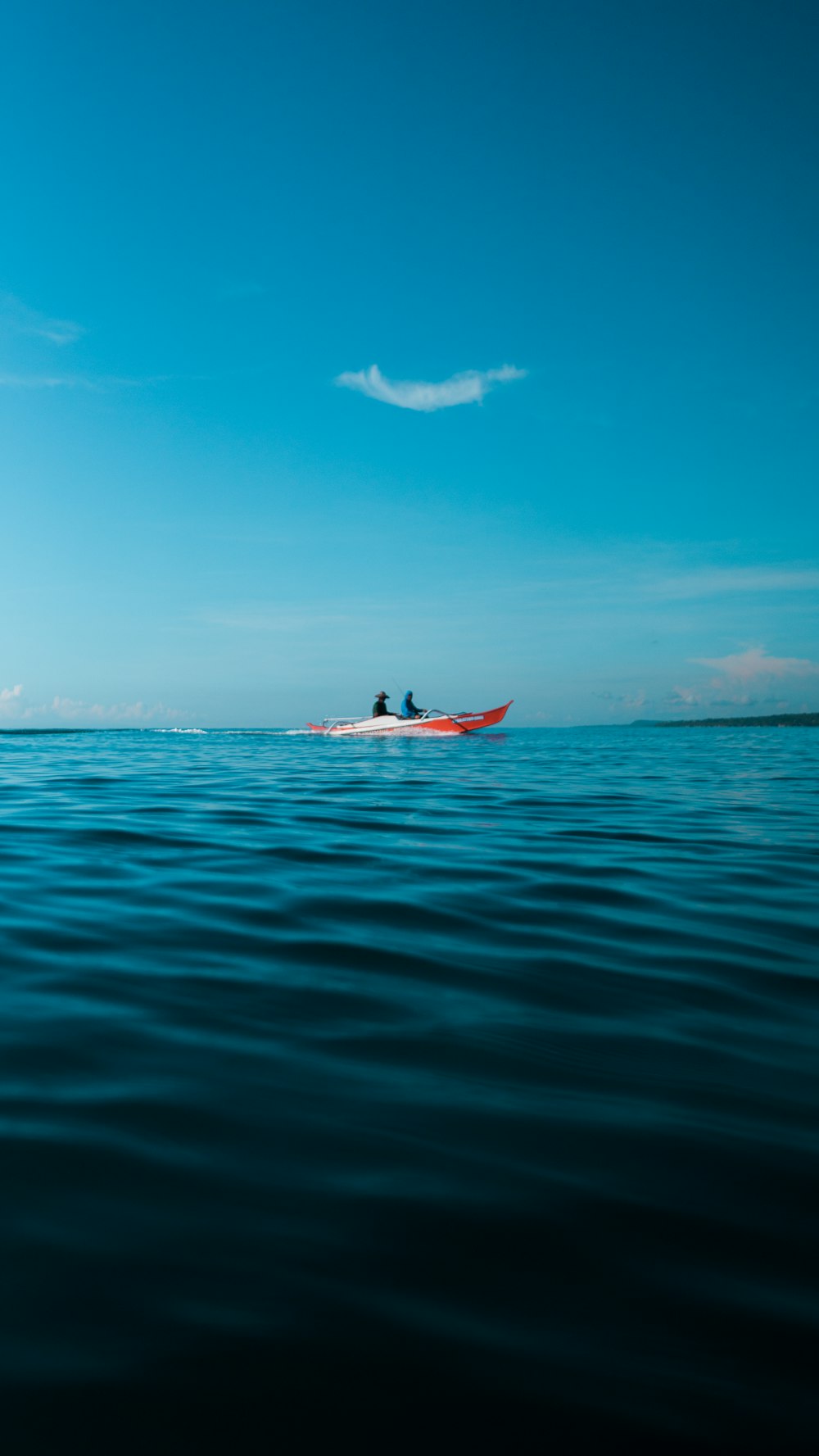 man in red kayak on sea during daytime