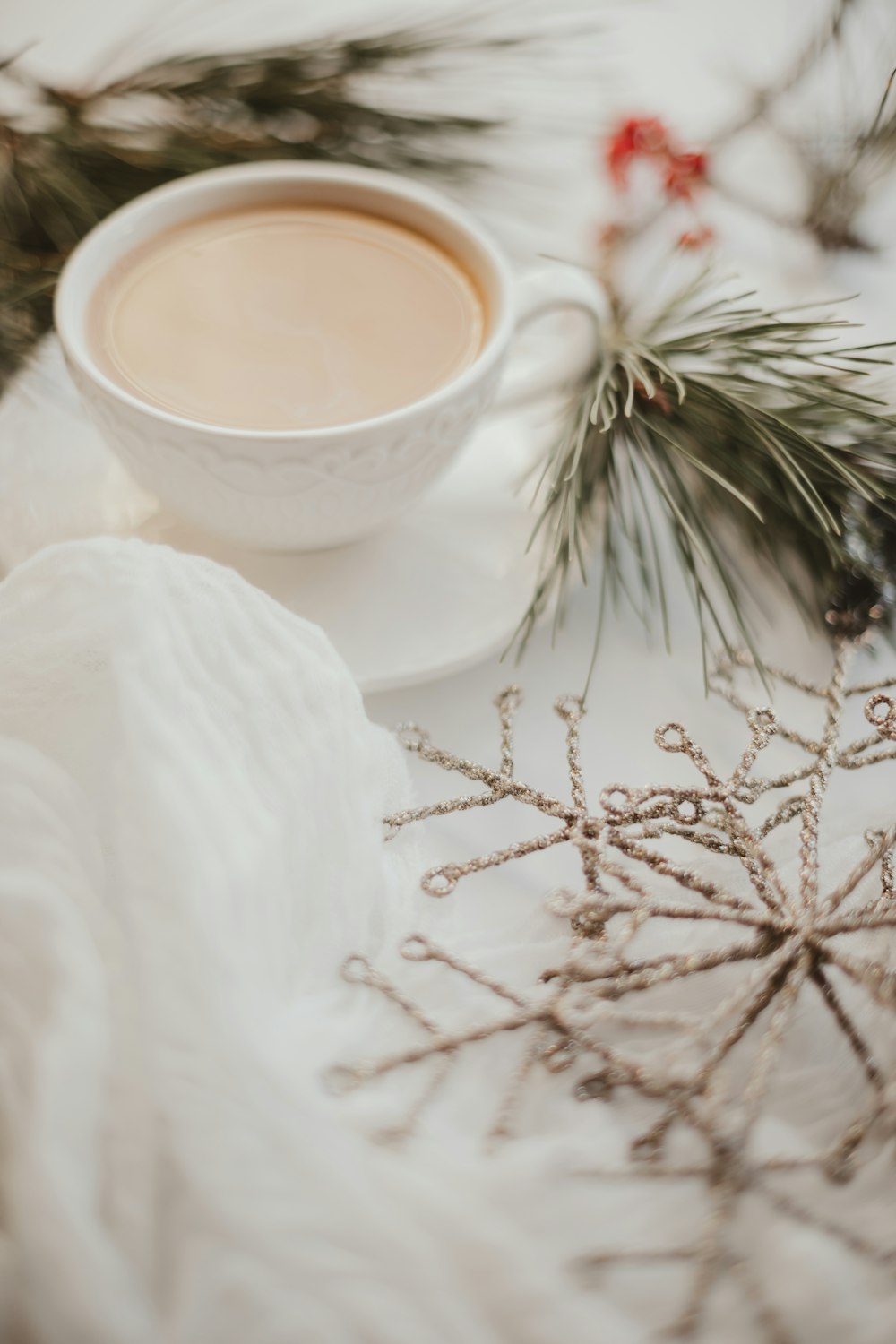 white ceramic cup with brown liquid