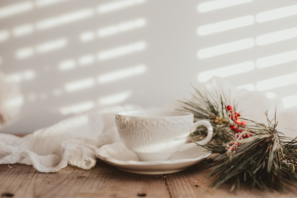 white ceramic teacup on white ceramic saucer