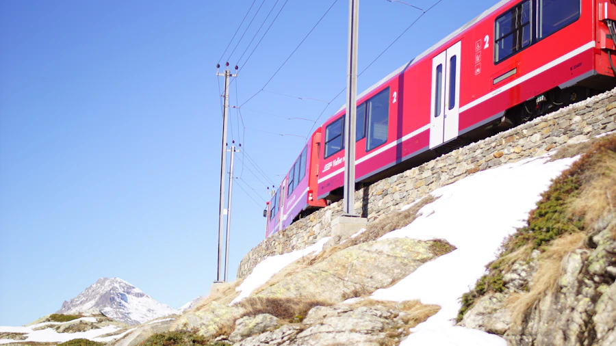 Red and white Swiss train on a mountain rail line
