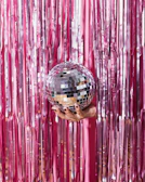 person holding red and black ball