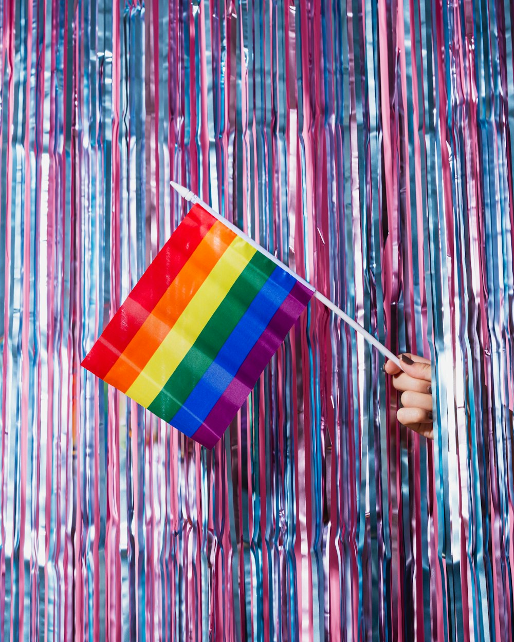 multi colored striped umbrella on wall