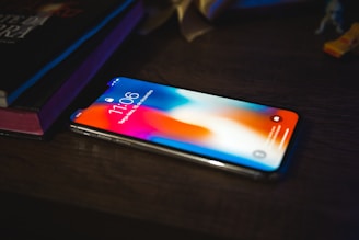 black android smartphone on black table