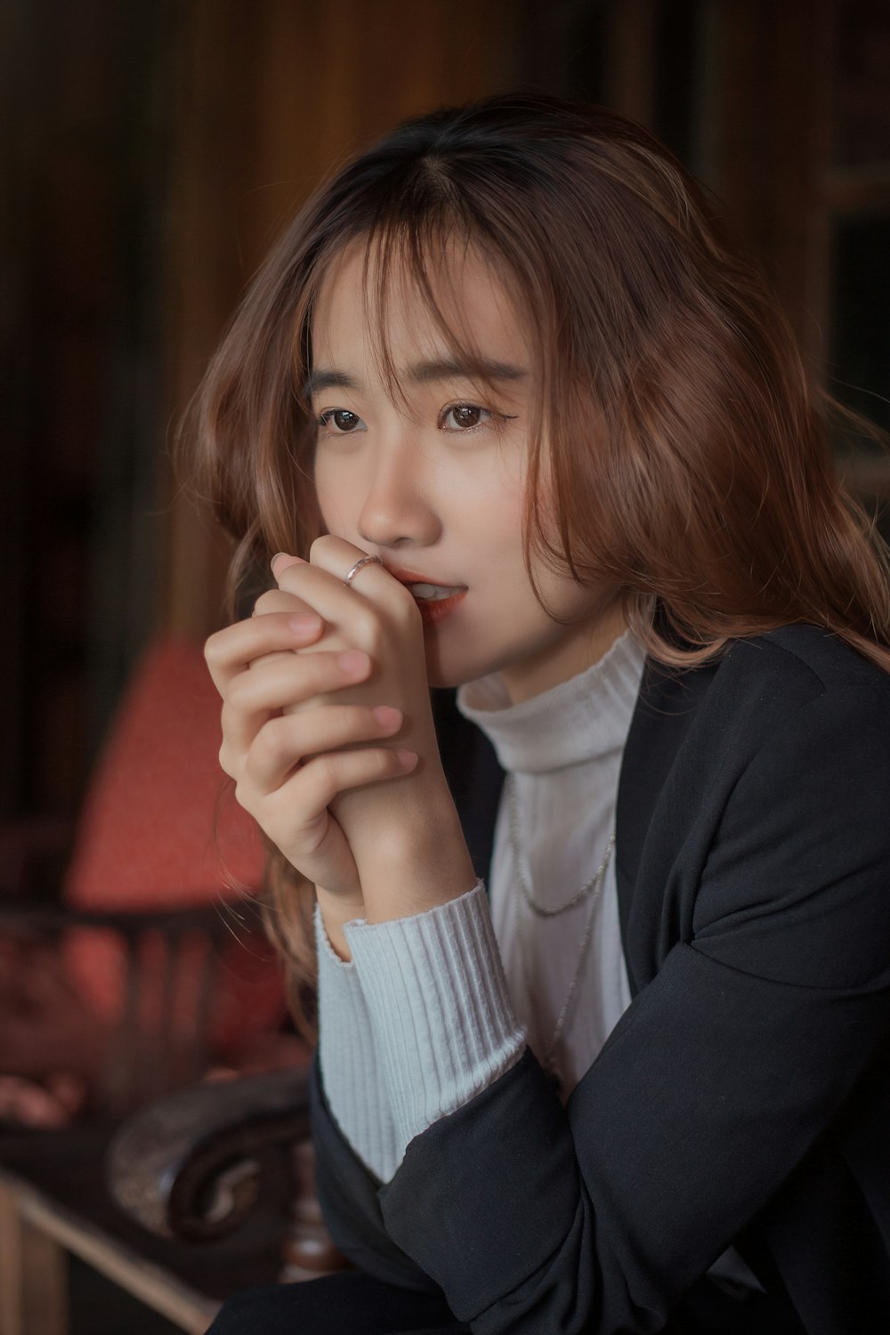 woman in black cardigan and white shirt