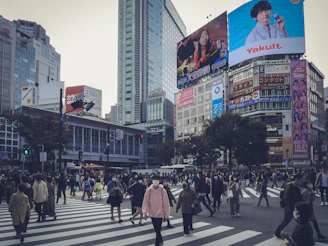 A dynamic city street crowded with people, highlighting trending topics.