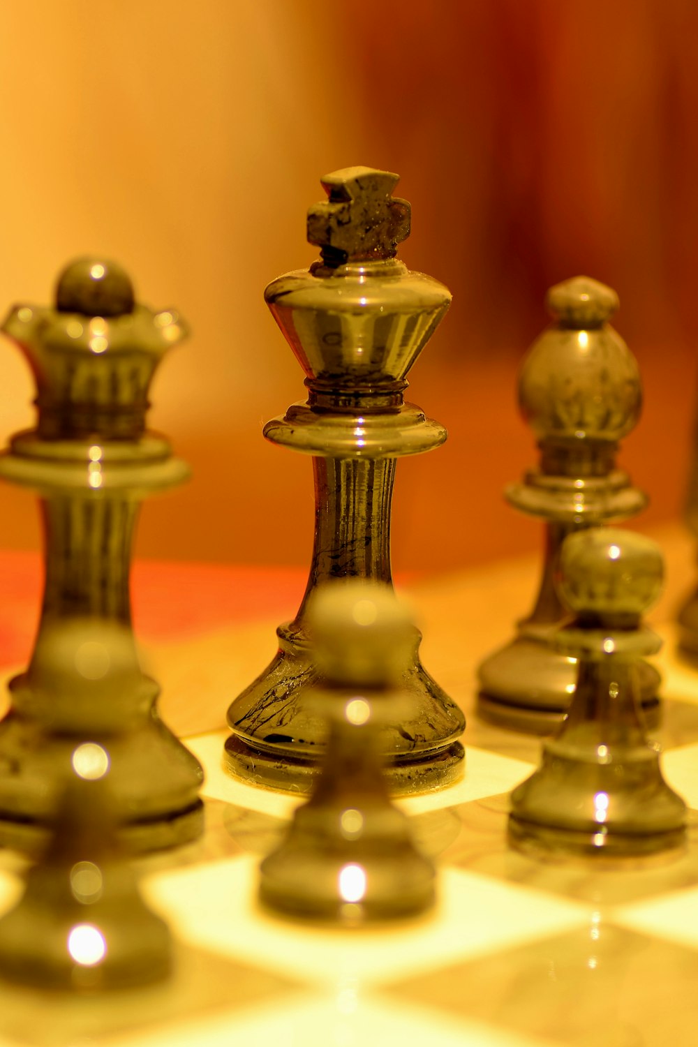 gold chess pieces on white table