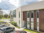 Exterior view of a cozy office building at 5801 Whisperwood Dr, Durham.
