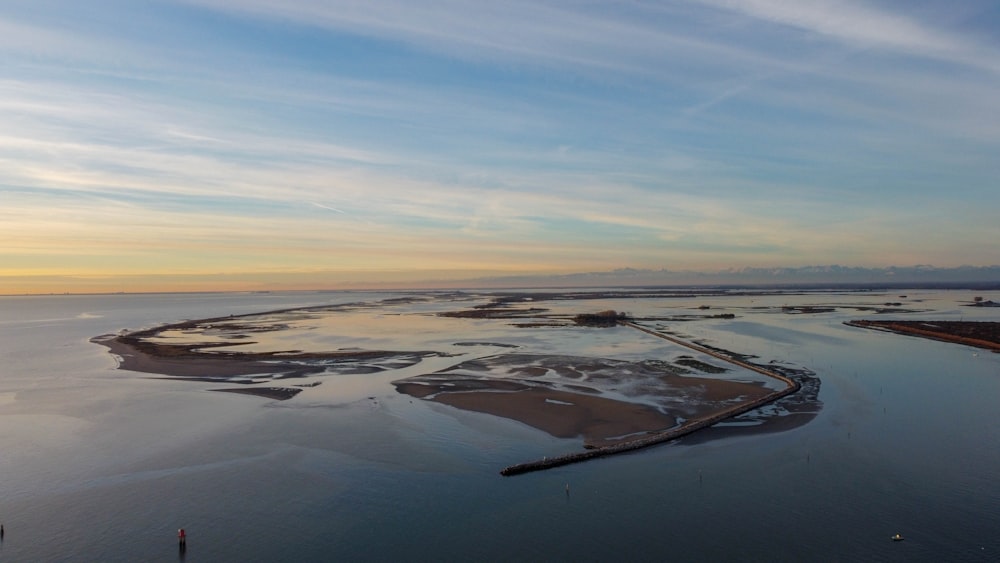 body of water under blue sky during daytime