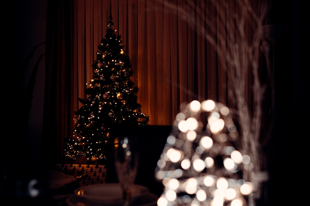 lighted christmas tree on table