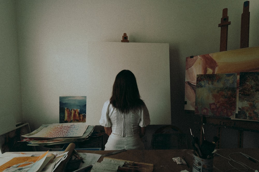 woman in white long sleeve shirt sitting on chair