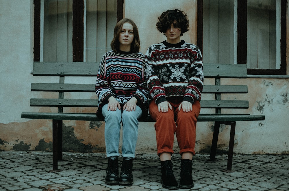 2 women sitting on bench