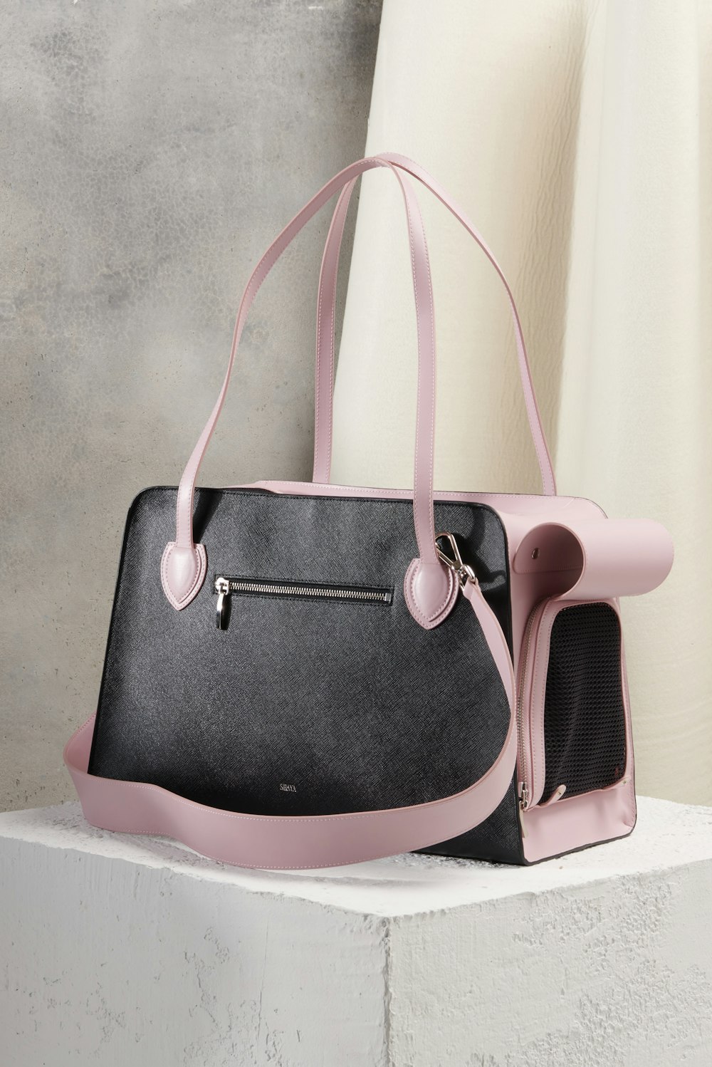 black and pink leather handbag