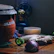 A warm kitchen scene with a bowl of steaming organic rice and rustic wooden utensils.